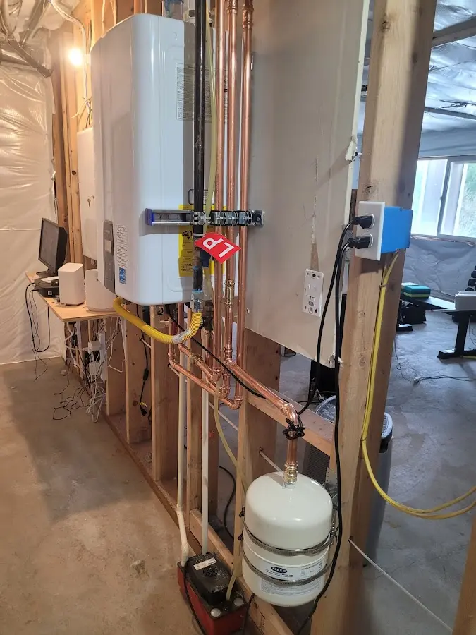 Licensed plumber repairing a kitchen sink in Spring Creek